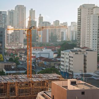 Aerial view of a commercial construction site and construction equipment.